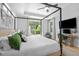 The main bedroom, lit with natural light, offers a backyard view, and workspace at 248 Speight Branch Rd, Cary, NC 27518