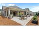 Spacious backyard patio with outdoor kitchen, dining area, and stone fireplace at 248 Speight Branch Rd, Cary, NC 27518