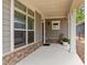 Inviting covered porch with stone accents, neutral siding, and ample space for relaxing at 248 Speight Branch Rd, Cary, NC 27518