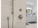 This shower features a sleek hand shower with modern fixtures, and a view to the bathroom at 248 Speight Branch Rd, Cary, NC 27518