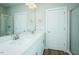 Modern bathroom with double sinks, quartz countertops, and sleek fixtures at 2803 Ricolden Trl, Elon, NC 27244