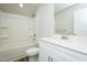 Clean bathroom with white vanity, quartz counters, tub-shower combo, and modern fixtures at 2803 Ricolden Trl, Elon, NC 27244