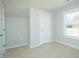 Bedroom featuring neutral carpet, light walls, a window, and closet at 2803 Ricolden Trl, Elon, NC 27244