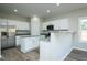 Modern kitchen featuring stainless steel appliances, granite countertops, and a convenient breakfast bar at 2803 Ricolden Trl, Elon, NC 27244