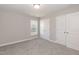 Bedroom featuring neutral walls, plush carpeting, and windows that provide natural light at 3001 Sadie Hopkins St, Raleigh, NC 27616