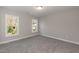 Bedroom featuring neutral walls, plush carpeting, and windows that provide natural light at 3001 Sadie Hopkins St, Raleigh, NC 27616