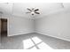 Spacious bedroom with plush carpeting, a tray ceiling and natural light from a large window at 3001 Sadie Hopkins St, Raleigh, NC 27616