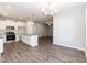 Modern kitchen featuring granite countertops, stainless steel appliances, and an island with seating at 3001 Sadie Hopkins St, Raleigh, NC 27616