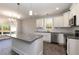 Spacious kitchen featuring granite counters, stainless steel appliances, and an island with seating at 3001 Sadie Hopkins St, Raleigh, NC 27616