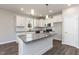 Modern kitchen featuring granite countertops, stainless steel appliances, island with pendant lights at 3001 Sadie Hopkins St, Raleigh, NC 27616