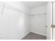 Walk-in closet featuring carpet floors and built-in wire shelving for storage and organization at 3001 Sadie Hopkins St, Raleigh, NC 27616