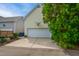 Detached garage with a driveway and basketball hoop for recreational enjoyment at 4001 Falls River Ave, Raleigh, NC 27614
