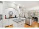 Modern kitchen featuring white cabinetry, black countertops, and stainless steel appliances at 4001 Falls River Ave, Raleigh, NC 27614