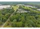 Lush greenery surrounds residential buildings; aerial view shows community layout and beautiful landscape at 402 Forest Rd, Oxford, NC 27565