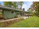 Charming backyard with a patio, lush landscaping, and an inviting outdoor space at 402 Forest Rd, Oxford, NC 27565
