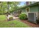 The home's backyard boasts an entertainment patio and a spacious yard at 402 Forest Rd, Oxford, NC 27565