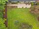 Aerial view of the backyard featuring a patio and lush greenery, creating a private oasis at 402 Forest Rd, Oxford, NC 27565