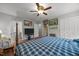 Bright bedroom featuring a cozy plaid-covered bed, and unique vintage decorations at 402 Forest Rd, Oxford, NC 27565