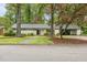 Charming home featuring a welcoming entrance, well-manicured landscaping, and a covered carport at 402 Forest Rd, Oxford, NC 27565