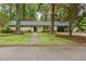 Charming single-story home with well-maintained lawn and mature trees enhancing curb appeal at 402 Forest Rd, Oxford, NC 27565