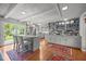 Modern kitchen featuring an island with bar seating, stainless steel appliances, and ample counter space at 402 Forest Rd, Oxford, NC 27565