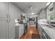 Modern kitchen is equipped with stainless steel appliances, sleek cabinetry, and granite counters at 402 Forest Rd, Oxford, NC 27565