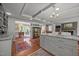 Open kitchen layout with an island, granite countertops, and easy access to the dining area at 402 Forest Rd, Oxford, NC 27565