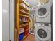 Functional laundry area with shelving, washer, dryer and ample storage space at 402 Forest Rd, Oxford, NC 27565