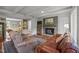 Cozy living room features a brick fireplace, hardwood floors, and comfortable seating at 402 Forest Rd, Oxford, NC 27565