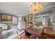 Cozy living room with chandelier leading to an open kitchen featuring stainless steel appliances at 402 Forest Rd, Oxford, NC 27565
