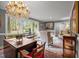 Comfortable living room area showcasing a chandelier and a large window with natural light at 402 Forest Rd, Oxford, NC 27565