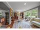 Elegant living room featuring large windows, hardwood floors, and refined decor at 402 Forest Rd, Oxford, NC 27565