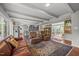 Spacious living area with hardwood floors, comfortable seating and seamless flow to kitchen at 402 Forest Rd, Oxford, NC 27565