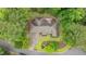 This is an overhead view of a well-maintained brick house with beautiful landscaping and a spacious driveway at 414 Bakewell Ct, Wake Forest, NC 27587