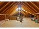Large unfinished attic with exposed beams, plywood subfloor and some stored boxes at 414 Bakewell Ct, Wake Forest, NC 27587