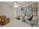 Bedroom featuring neutral walls, a ceiling fan, and a collection of wall art at 414 Bakewell Ct, Wake Forest, NC 27587