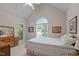 Spacious bedroom featuring large windows with backyard views, carpeted floors, and a vaulted ceiling at 414 Bakewell Ct, Wake Forest, NC 27587