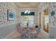 Bright breakfast nook featuring a glass top table, four chairs, and plenty of natural light at 414 Bakewell Ct, Wake Forest, NC 27587