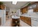Charming kitchen featuring warm wood cabinetry, a center island, and bright natural light from a skylight at 414 Bakewell Ct, Wake Forest, NC 27587