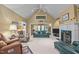 Cozy living room with high ceilings, a fireplace, and comfortable seating at 414 Bakewell Ct, Wake Forest, NC 27587