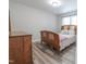 Cozy bedroom featuring a bed with a stylish accent pillow and a dresser at 420 E Grandview Ave, Liberty, NC 27298