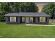 Charming single-story home with a well-manicured lawn and attractive curb appeal at 420 E Grandview Ave, Liberty, NC 27298