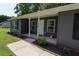 Inviting front porch featuring classic columns and fresh landscaping around the home at 420 E Grandview Ave, Liberty, NC 27298
