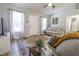 Cozy living room filled with natural light, featuring neutral decor, a patterned rug, and comfortable seating at 420 E Grandview Ave, Liberty, NC 27298