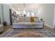 Inviting living room with comfortable seating, a patterned rug, and an open view into the kitchen at 420 E Grandview Ave, Liberty, NC 27298