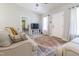 Comfortable living room with plush seating, stylish rug, and a view into another room at 420 E Grandview Ave, Liberty, NC 27298