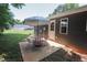 Cozy outdoor patio with an umbrella table and chairs, perfect for relaxing or entertaining guests at 420 E Grandview Ave, Liberty, NC 27298