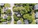 A top-down aerial view shows the home and other homes in the neighborhood, surrounded by green lawns and trees at 4213 Stoneford Trace Dr, Raleigh, NC 27616