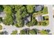A top-down aerial view shows the home and other homes in the neighborhood, surrounded by green lawns and trees at 4213 Stoneford Trace Dr, Raleigh, NC 27616