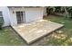 A newly installed back deck offers ample space for outdoor entertaining, seamlessly blending with the lush backyard at 4213 Stoneford Trace Dr, Raleigh, NC 27616
